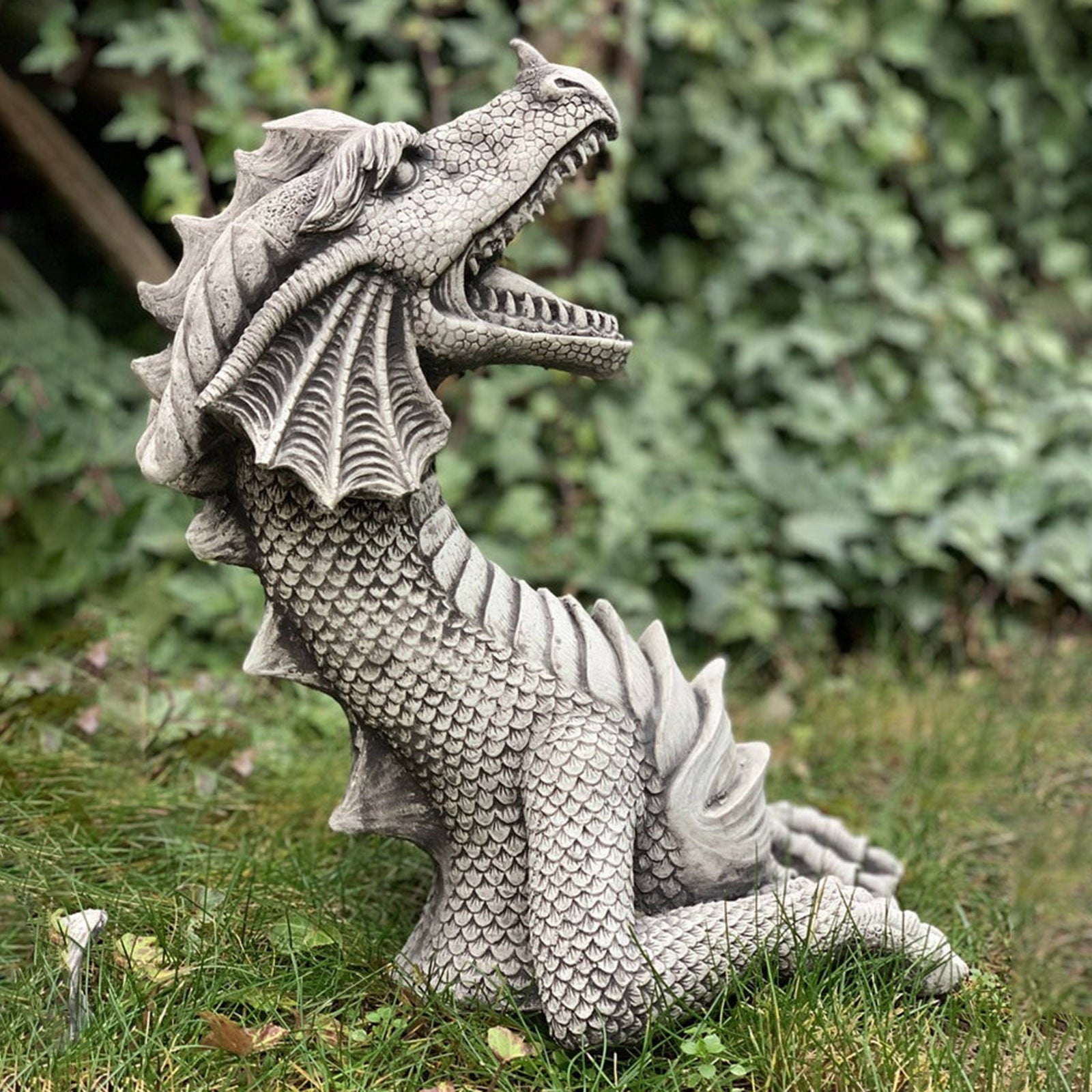 Enhance your outdoor space with a Large Dragon Gothic Garden Statue. Perfect for adding a mystical touch to your garden or patio decor