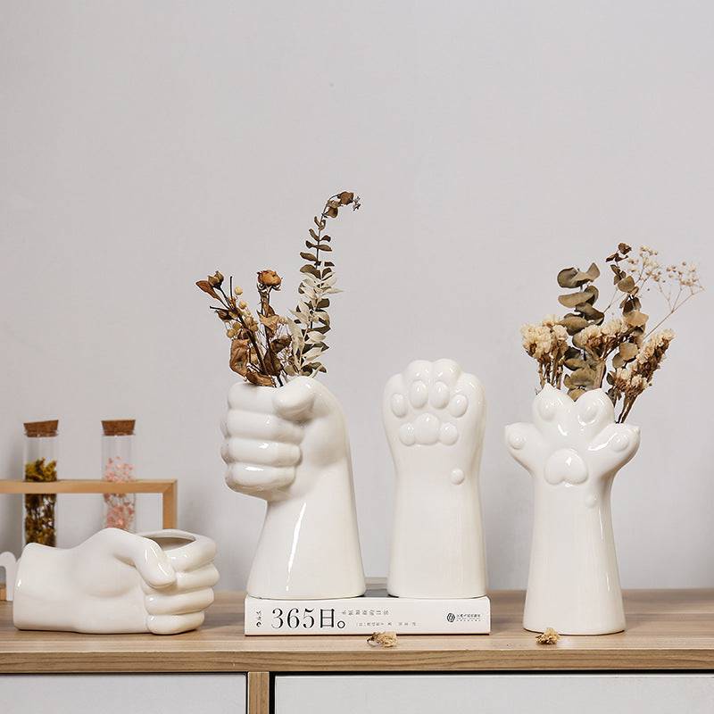 Enhance your living room with simple ceramic vases, perfect for elegant flower arrangements. Add a touch of style to your home furnishings today!